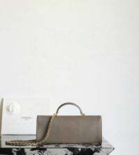 CC Calfskin Lizard Embossed Clutch